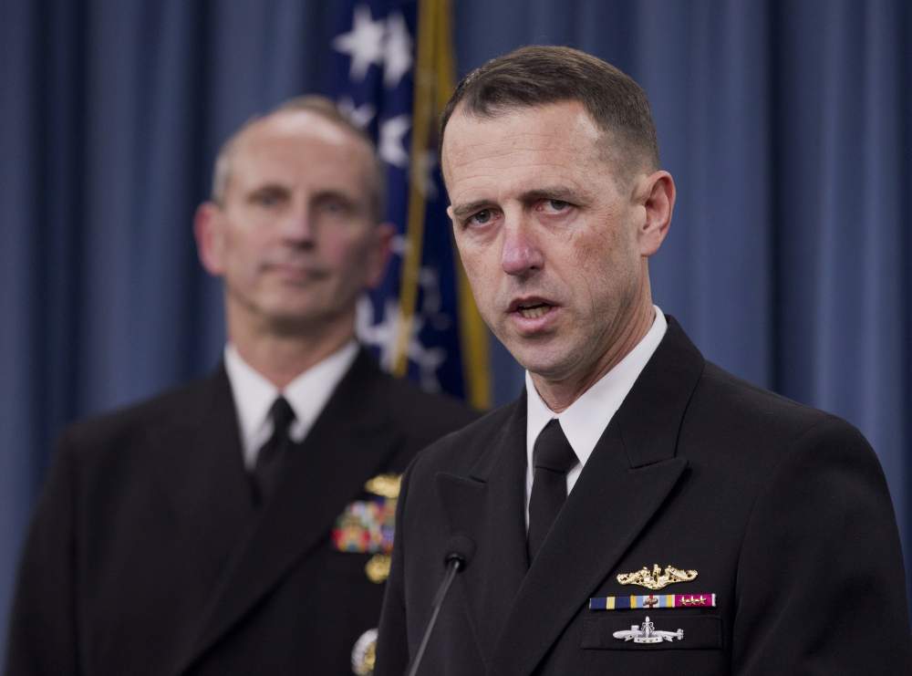 Adm. John M. Richardson, director of the Naval Nuclear Propulsion Program, right, accompanied by Chief of Naval Operations Adm. Jonathan W. Greenert, speaks about alleged cheating on tests by senior enlisted sailors training on naval nuclear reactors at Charleston, S.C.
