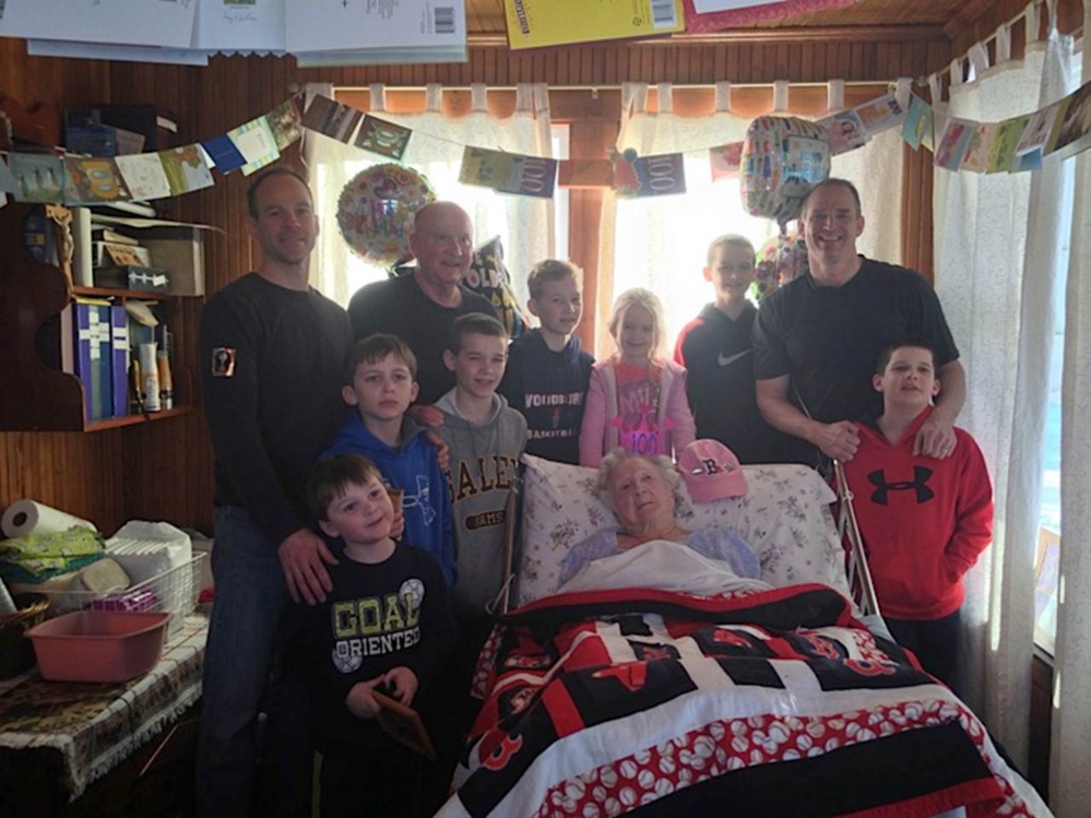 BIRTHDAY GIRL: Mary Burns, center, celebrates her 100th birthday with a son, grandsons and seven of her great-grandchildren at the Augusta home she shares with son Gary and daughter-in-law Carolyn.