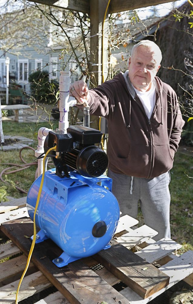 Charles Davison, a retired high school principal, installed a pump on an unused well to help supplement his household water supply in Willits, Calif.
