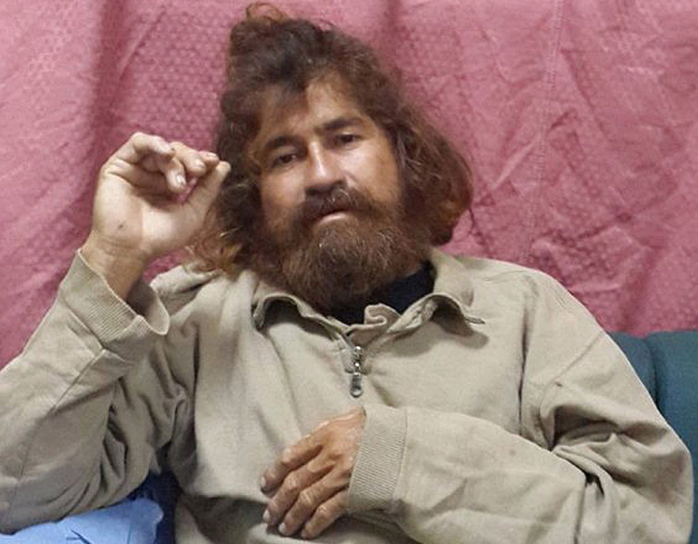 In this photo provided by the Marshall Islands Foreign Affairs Department, 37-year-old Jose Salvador Alvarenga sits on a couch in Majuro in the Marshall Islands, after he was rescued from being washed ashore on the tiny atoll of Ebon in the Pacific Ocean.