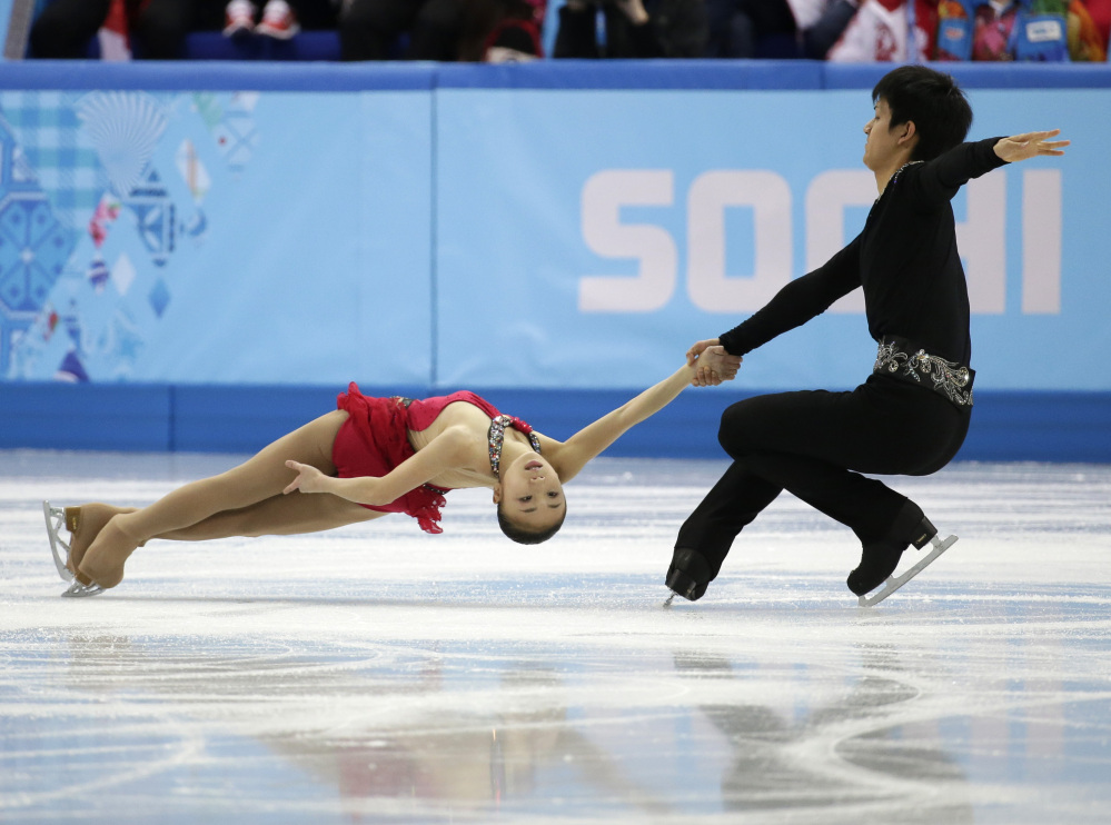 Narumi Takahashi and Ryuichi Kihara of Japan compete in the team pairs short program figure skating competition at the Iceberg Skating Palace during the 2014 Winter Olympics, Thursday, Feb. 6, 2014
