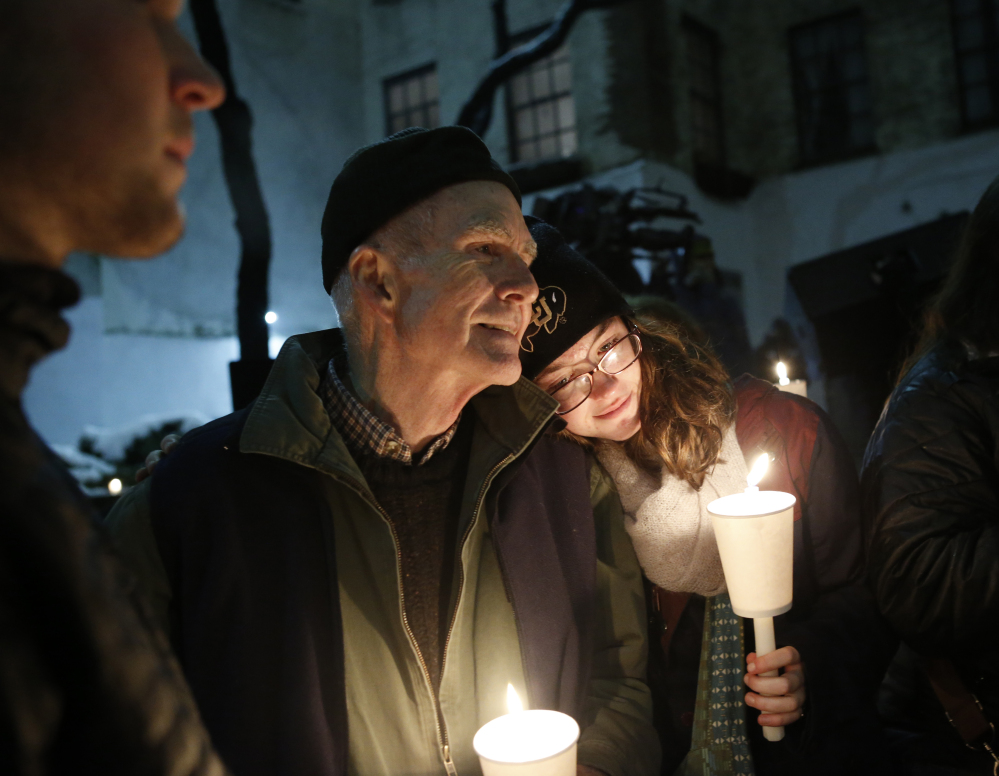 People hold candles during a candlelight vigil and remembrance for actor Philip Seymour Hoffman that was held Wednesday night in the courtyard behind the Labyrinth Theater Company on Bank Street. Hoffman was a member and former artistic director of Labyrinth.