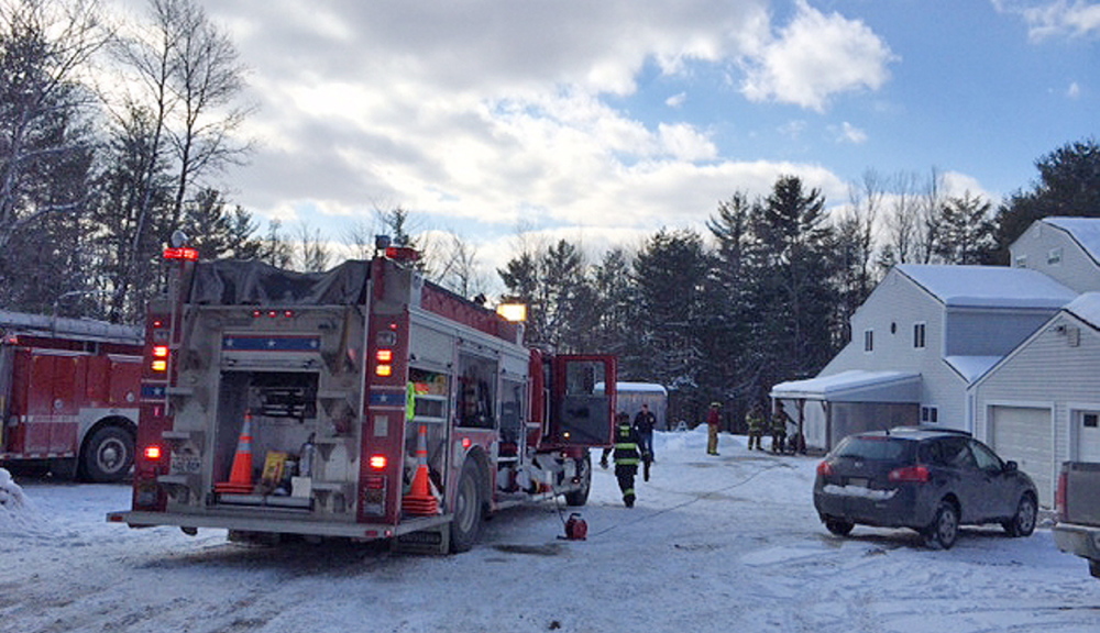 fire scene: Firefighters respond to a house fire Friday at 237 Shusta Road in Madison.