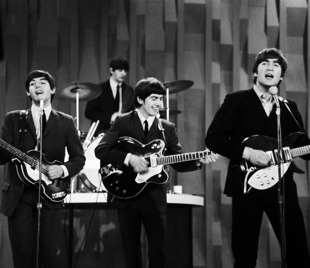 In this Feb. 9, 1964 photo, The Beatles, from left, Paul McCartney, Ringo Starr on drums, George Harrison and John Lennon, perform for the CBS “Ed Sullivan Show” in New York, as they record a set that would later be shown on the Feb. 23 broadcast of the show. The Beatles made their first broadcast appearance on “The Ed Sullivan Show,” America’s must-see weekly variety show, later in the day, Sunday, Feb. 9, 1964, officially kicking off Beatlemania.
