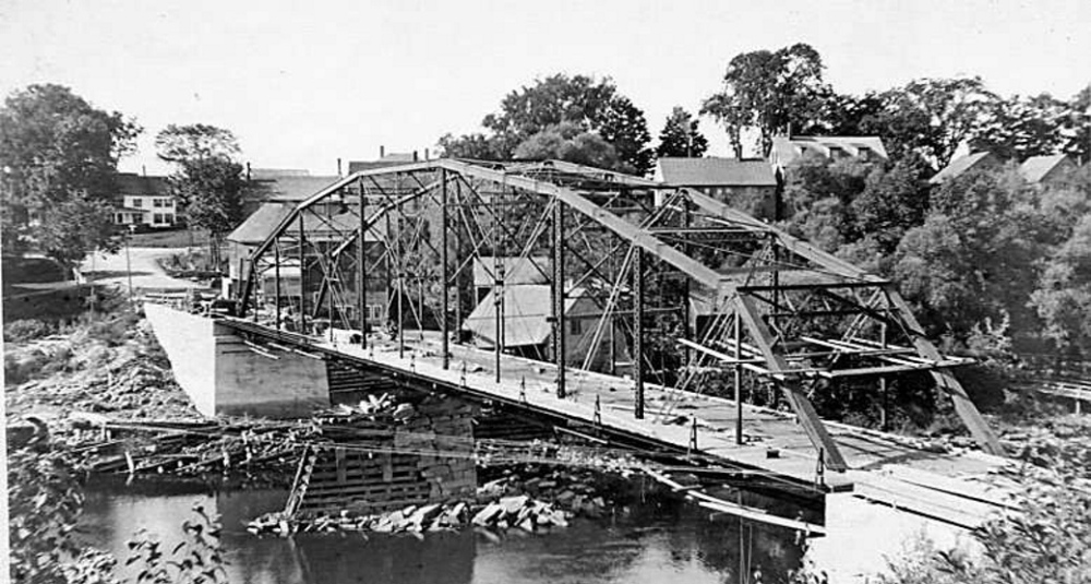 Unsafe: The iron bridge spanning the Sandy River is seen in 1916 during its construction. The bridge is expected to be torn down by March 21.