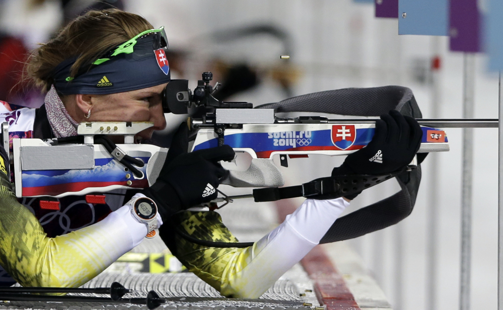Slovakia’s Anastasiya Kuzmina shoots on her way to win the gold medal in the women’s biathlon 7.5k sprint Sunday at the 2014 Winter Olympics in Krasnaya Polyana, Russia.