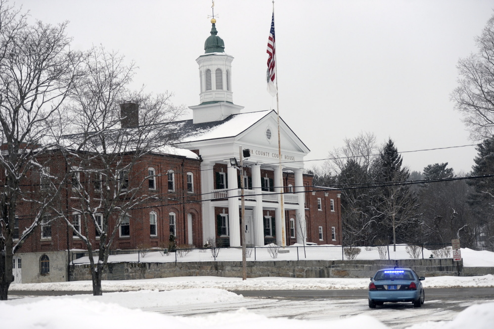 A Maine State Police car parks in front of the York County Courthouse in Alfred on Monday while police investigate a bomb threat.