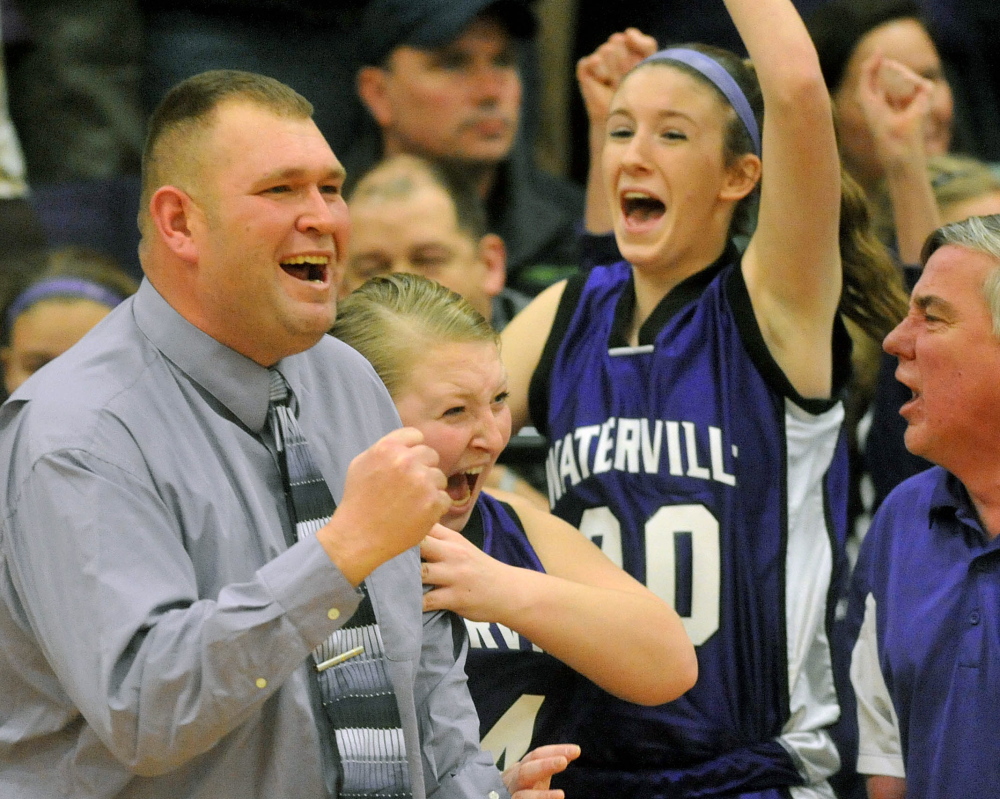 Staff photo by Michael G. Seamans HIGH SCHOOL BASKETBALL: Waterville Senior High School head basketball coach Rob Rodrigue celebrates an upset victory over number 4 ranked Winslow High School 42-34 in Winslow on Tuesday.