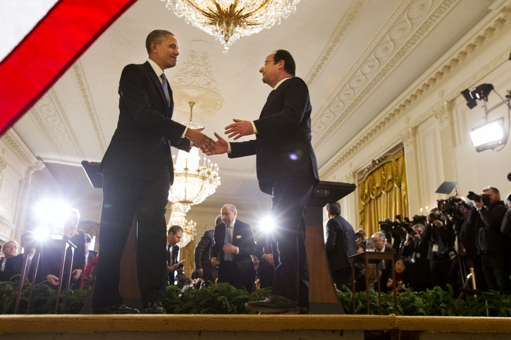 President Barack Obama shakes hands with French President Francois Hollande after their news conference in the East Room of the White House in Washington, Tuesday.