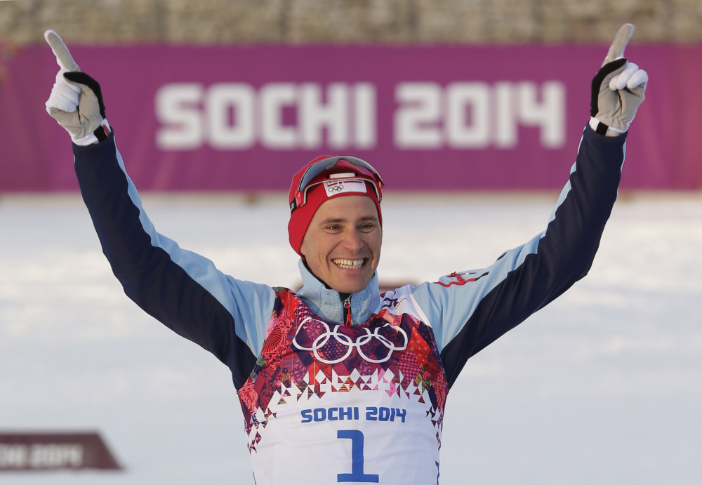 Norway’s Ola Vigen Hattestad celebrates winning the gold medal during the flower ceremony for the men’s cross-country sprint at the 2014 Winter Olympics, Tuesday in Krasnaya Polyana, Russia.