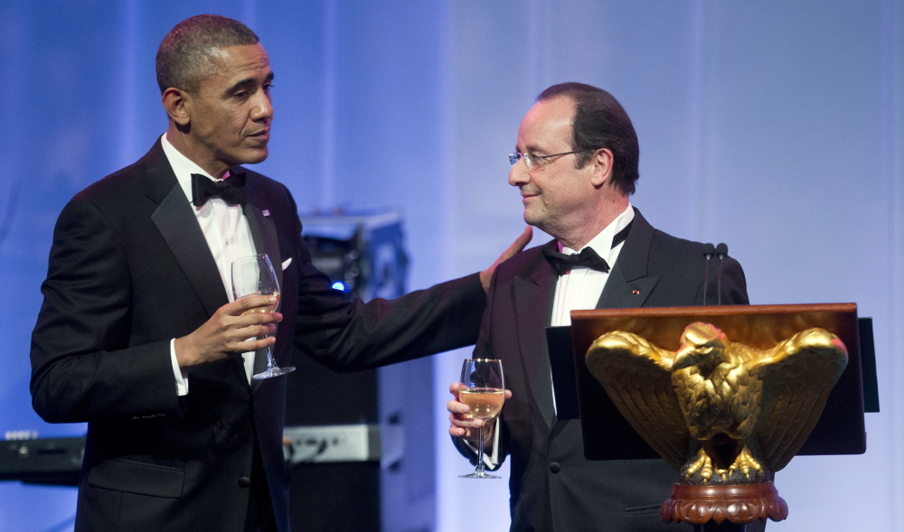 President Obama completes his toast to French President Francois Hollande at a White House state dinner on Tuesday.