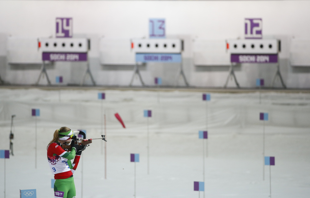 Belarus’ Darya Domracheva shoots on her way to win the gold medal in the women’s biathlon 10k pursuit, at the 2014 Winter Olympics, Tuesday, in Krasnaya Polyana, Russia.