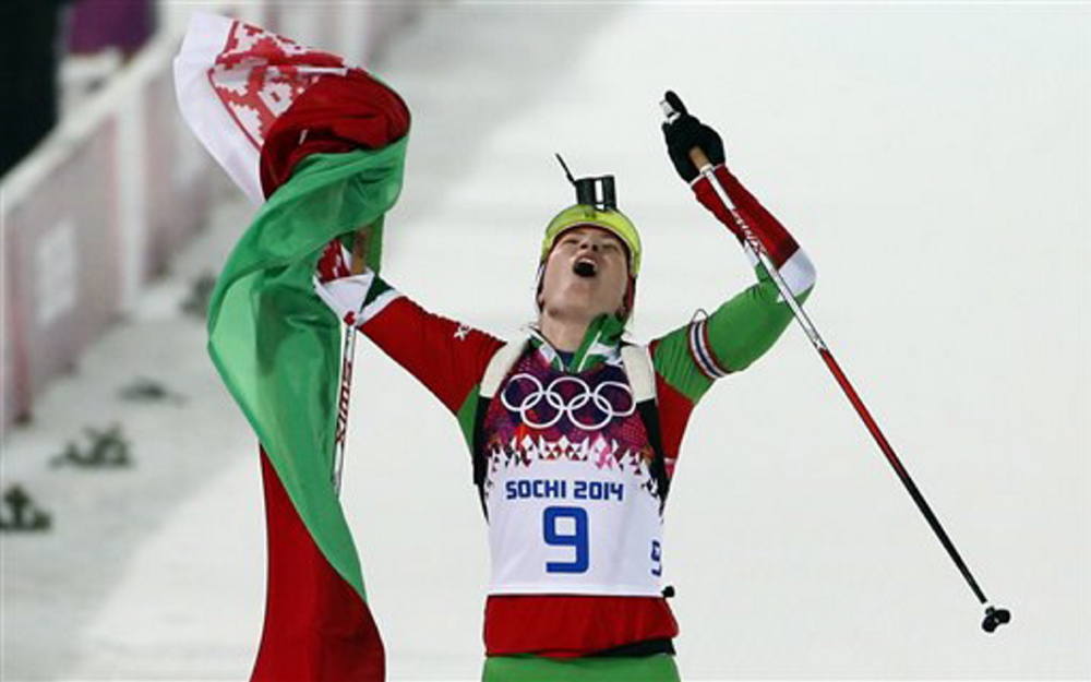Belarus’ Darya Domracheva celebrates after winning the gold medal in the women’s biathlon 10k pursuit, at the 2014 Winter Olympics Tuesday in Krasnaya Polyana, Russia.