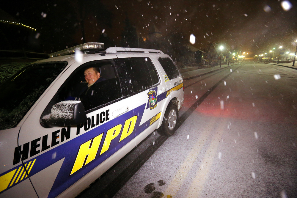 Helen police officer Lee Johannsen in his four-wheel drive vehicle is the only thing moving through the Alpine City of Helen, Ga., in the Southern Appalachian Mountains on Wednesday.