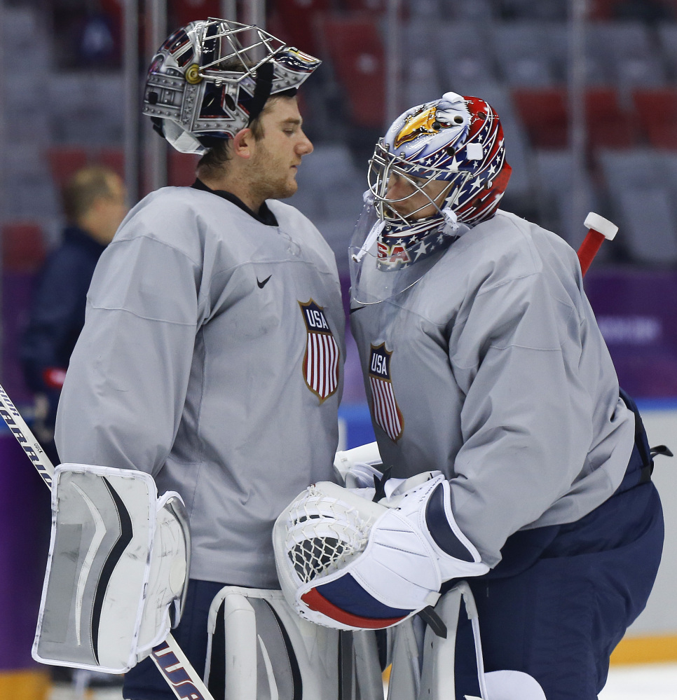 USA goaltender Jonathan Quick, left, talks with goaltender Jimmy Howard during a training session in Sochi, Russia.