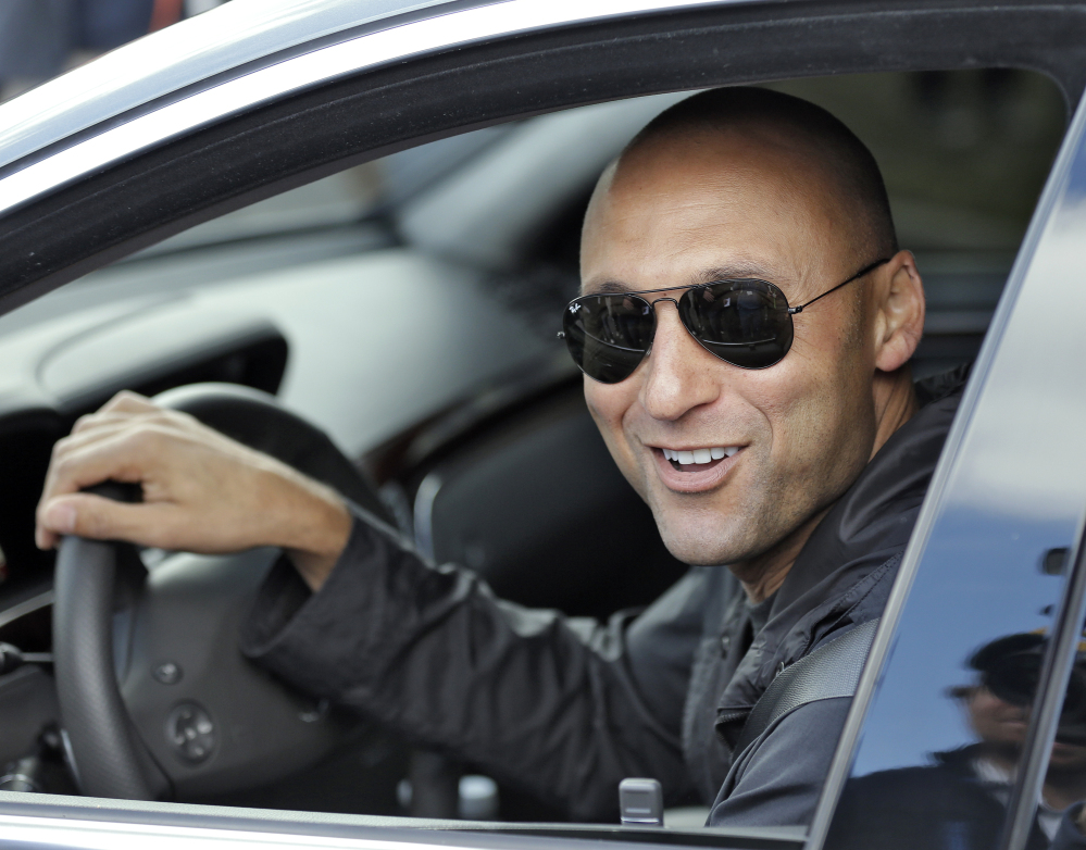 BACK AT IT: New York Yankees shortstop Derek Jeter smiles as he leaves after practicing at the baseball team’s minor league facility Thursday, Feb. 13, 2014, in Tampa, Fla. Jeter announced that he will be retiring after the 2014 season.