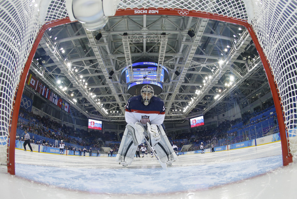 USA goaltender Jonathan Quick looks back into the net before the game against Slovakia during the men’s ice hockey tournament at the 2014 Winter Olympics, Thursday, in Sochi, Russia.