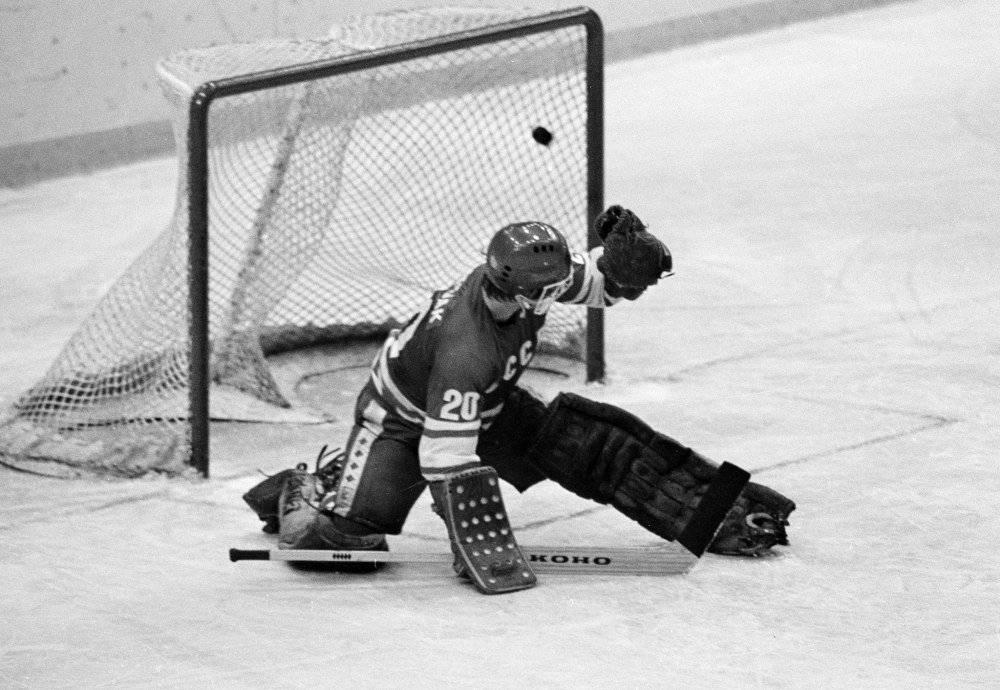 FILE - In this 1980 file photo, Soviet goalie Vladislav Tretiak allows a goal by the U.S. team in the first period of a medal-round hockey game at the 1980 Winter Olympics in Lake Placid, New York.