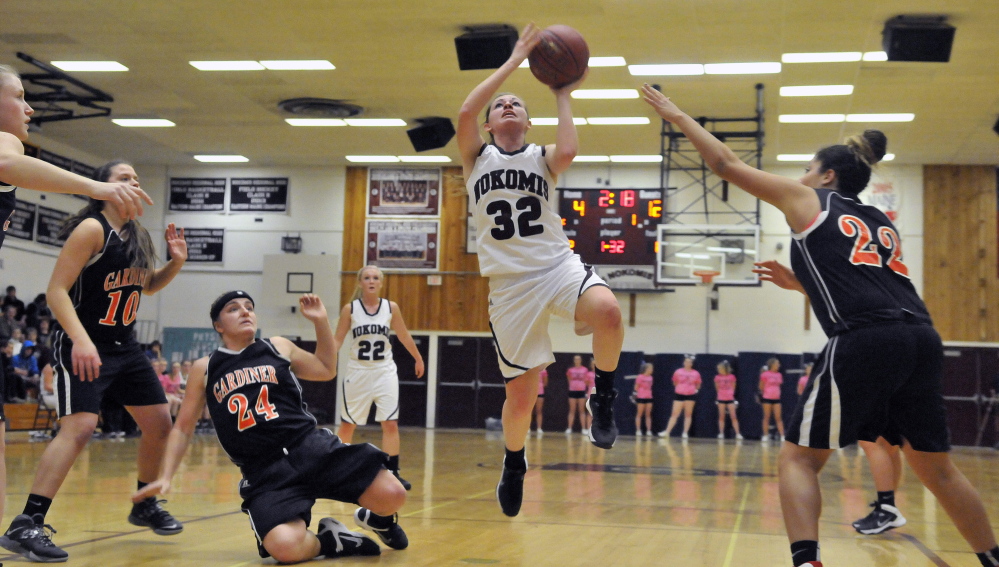 Staff photo by Michael G. Seamans Nokomis High School's Taylor Shaw, 32, drives to the basket against Gardiner High School in Newport on Wednesday.