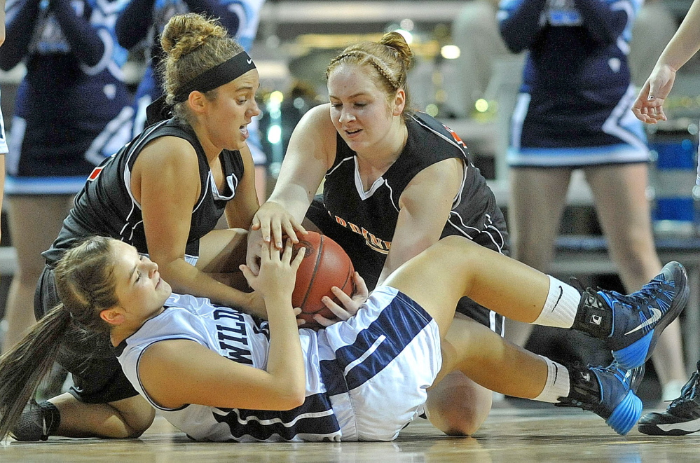 GET AFTER IT: Gardiner Area High School’s Nicole Chadwick, left, and Rachel Quirion (15) battle for a loose ball with Presque Isle High School’s Krystal Kingsbury in the first quarter of an Eastern Class B quarterfinal game Saturday at Cross Insurance Center in Bangor.