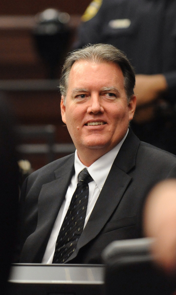 Michael Dunn smiles during a break in his trial Wednesday in Jacksonville, Fla. He was found guilty of three counts of attempted murder.
