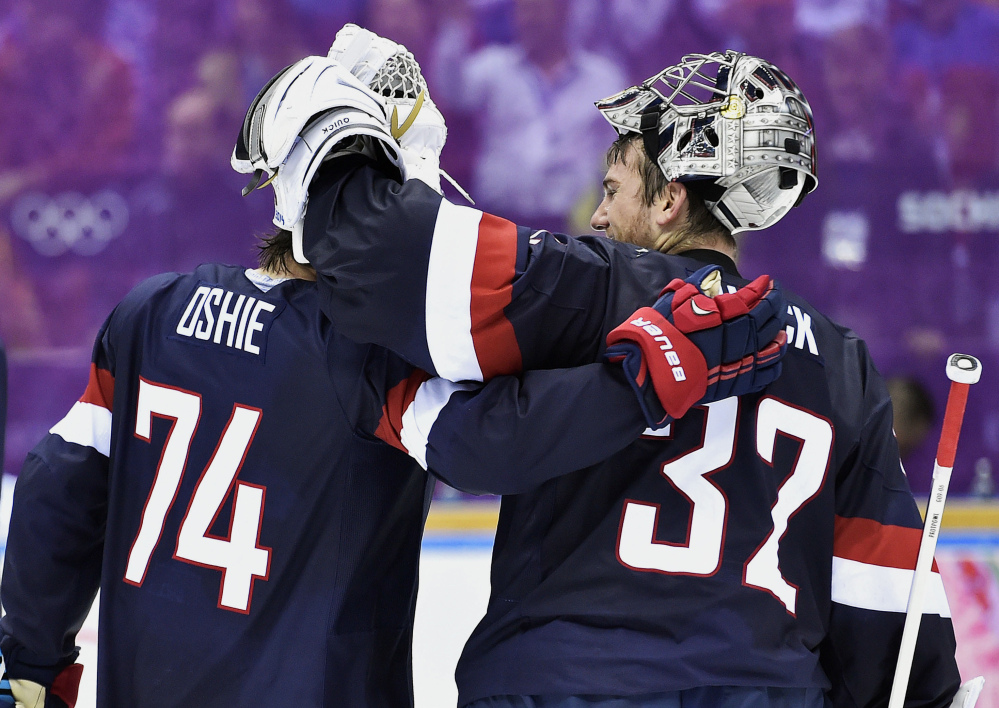 United States forward T.J. Oshie, left, congratulates goalie Jonathan Quick after defeating Russia 3-2 in a shootout in a men’s hockey game at the 2014 Winter Olympics on Saturday in Sochi, Russia.