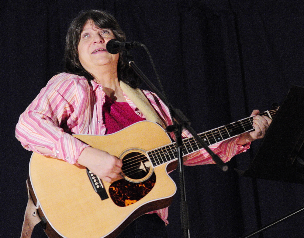 Navy veteran: Beth Revels performs a song during the 2014 Maine Veterans Creative Arts Festival on Saturday in the Togus auditorium. The event was presented by VA Maine Healthcare System-Togus and the Maine American Legion Auxiliary.