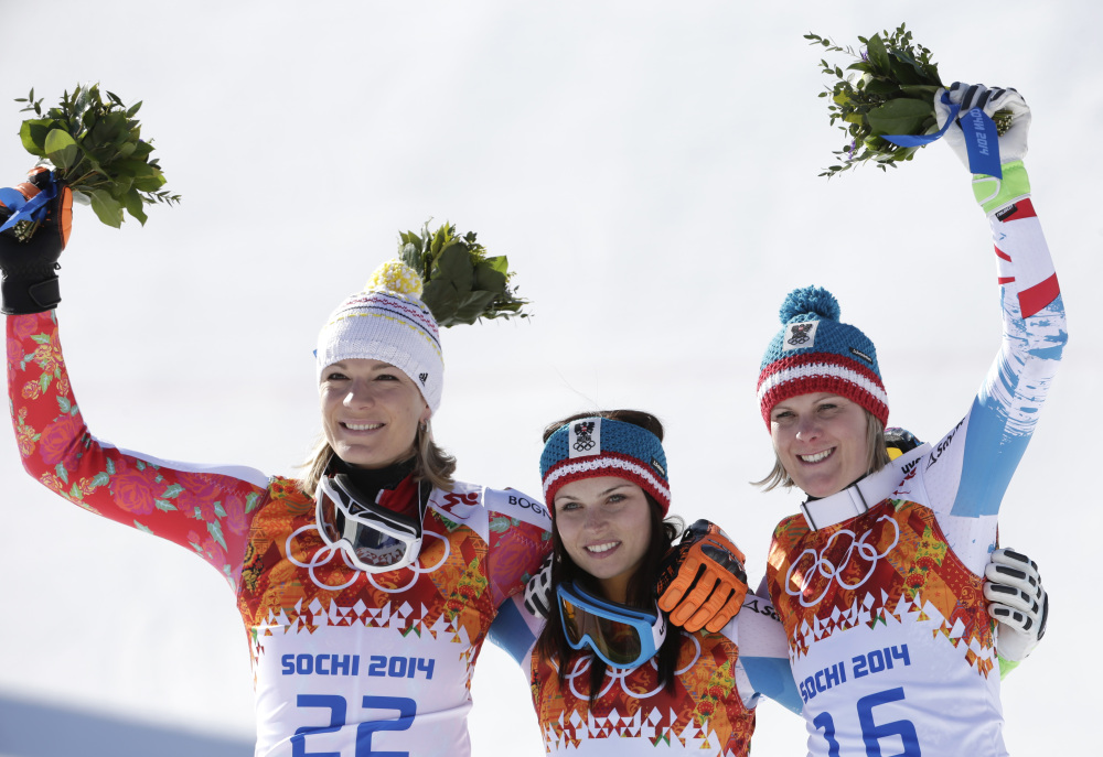 Women’s super-G medalists from left, Germany’s Maria Hoefl-Riesch (silver), Austria’s Anna Fenninger (gold) and Austria’s Nicole Hosp (bronze) pose for photographers on the podium at the Sochi 2014 Winter Olympics Saturda in Krasnaya Polyana, Russia.