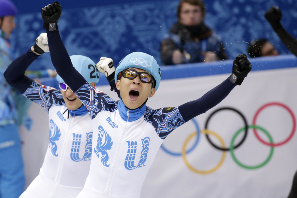 Viktor Ahn of Russia, right, celebrates winning in a men’s 1,000-meter short track speedskating final alongside Vladimir Grigorev of Russia, who placed second, at the Iceberg Skating Palace during the 2014 Winter Olympics in Sochi, Russia.