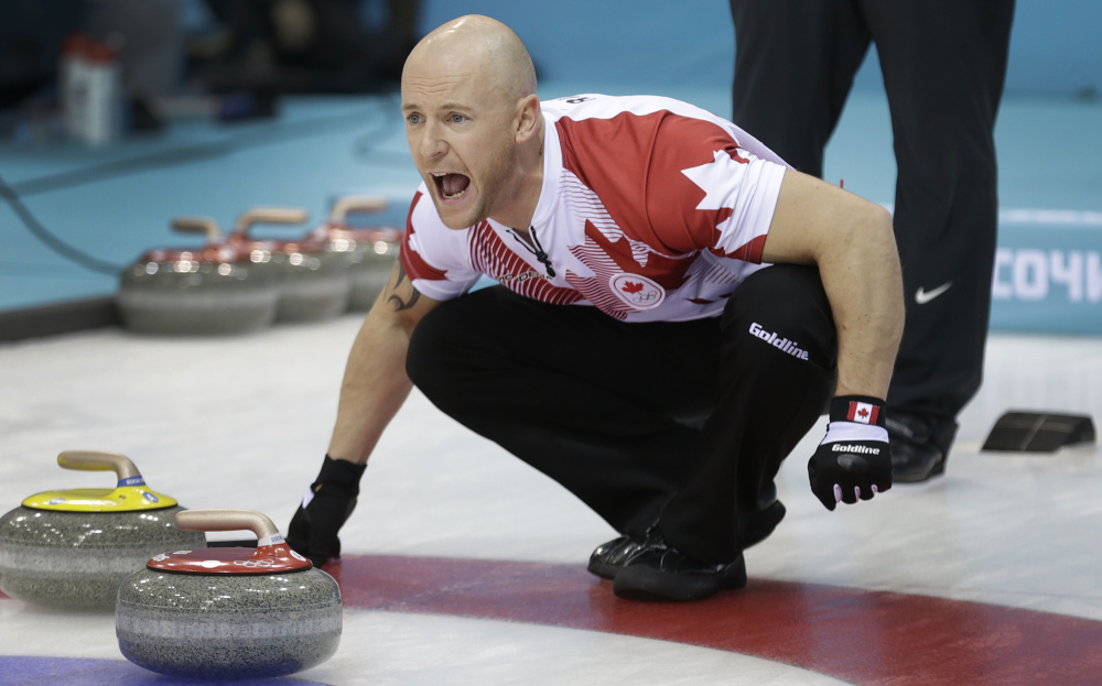 Canada’s Ryan Fry shouts instructions to his teammates during the men’s curling competition against the United States Sunday at the 2014 Winter Olympics in Sochi, Russia.