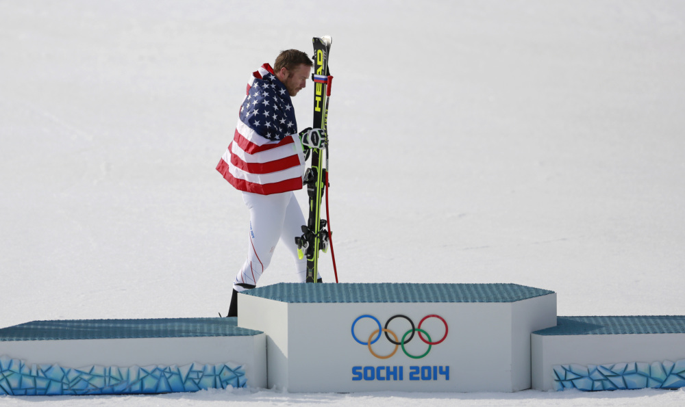 United States’ Bode Miller walks to the podium after winning the joint bronze medal in the men’s super-G.