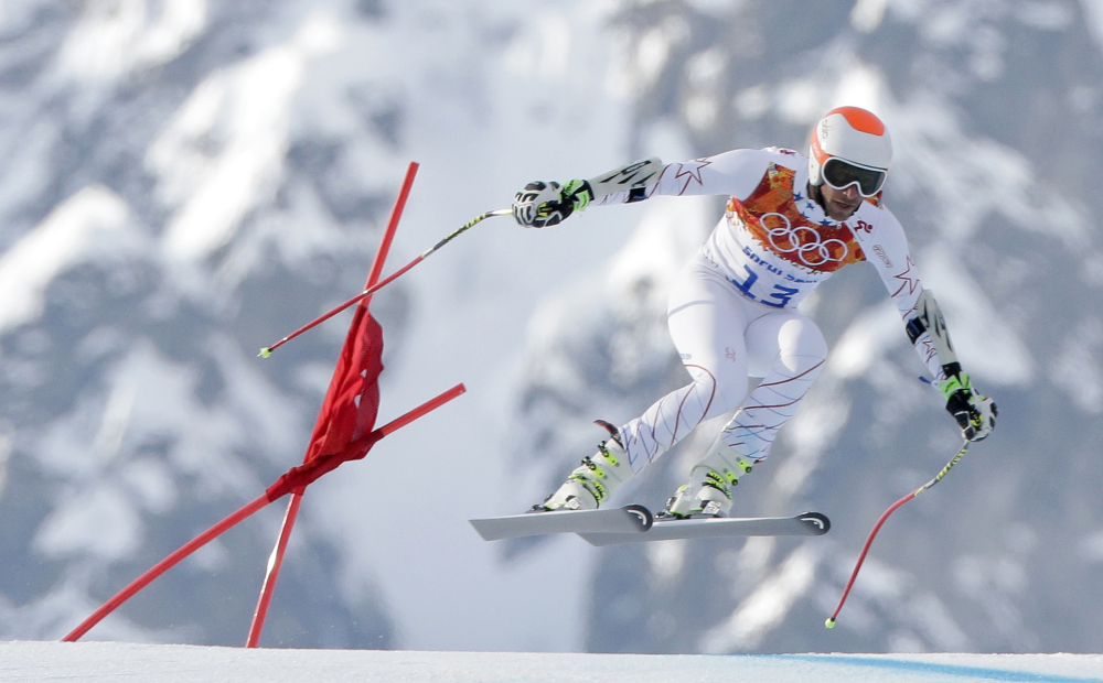 Joint bronze medal winner Bode Miller of the United States makes a jump in the men’s super-G at the Sochi 2014 Winter Olympics on Sunday at Krasnaya Polyana, Russia.