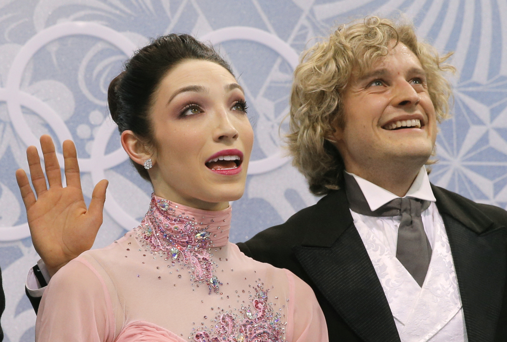 Meryl Davis and Charlie White of the United States wait in the results area after competing in the ice dance short dance figure skating competition at the Iceberg Skating Palace during the 2014 Winter Olympics Sunday in Sochi, Russia.