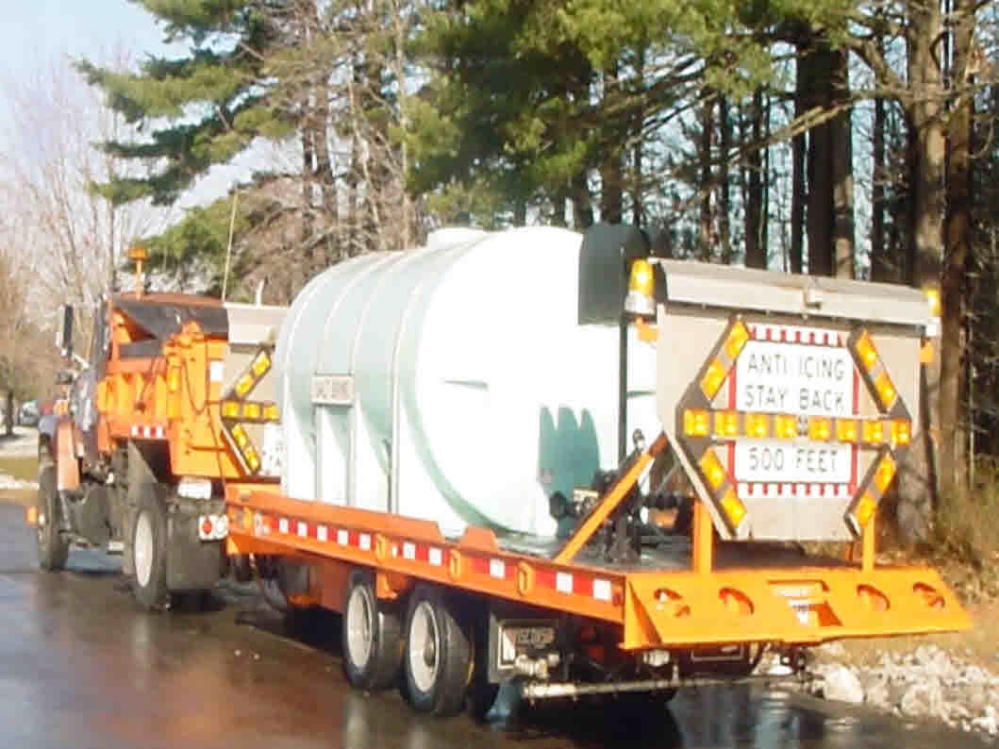 SALT: A state Department of Transportation truck pulls a container of salt brine.