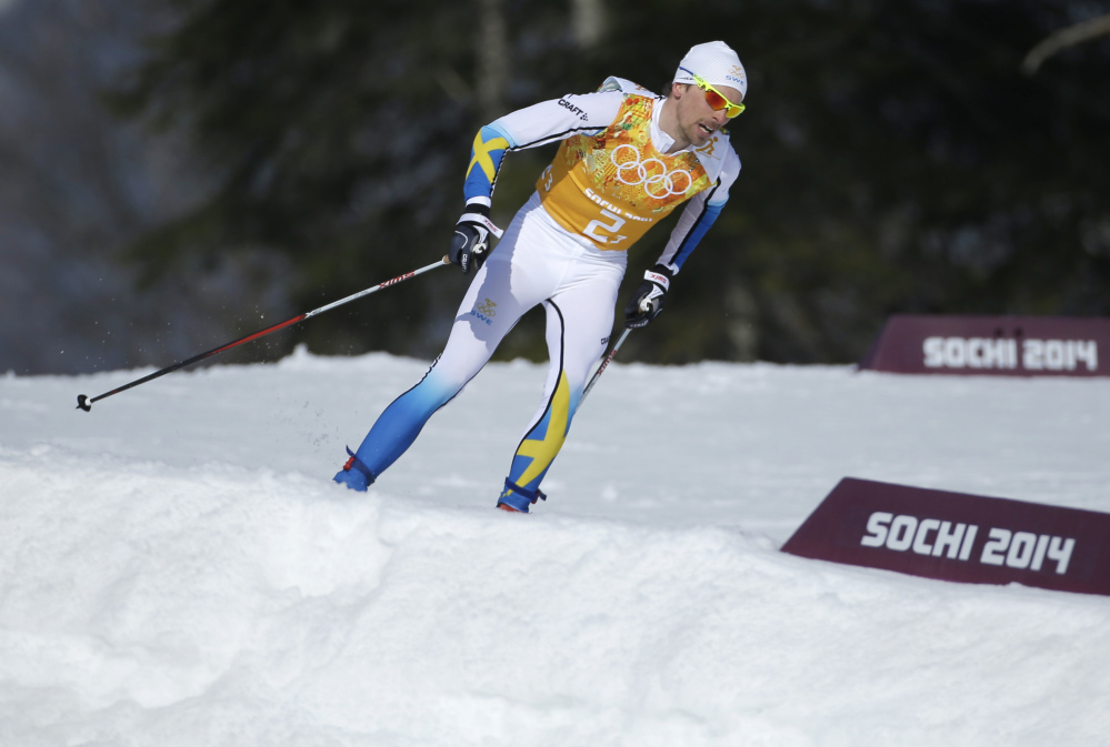 Sweden’s Johan Olsson skis during the men’s 4x10K cross-country relay at the 2014 Winter Olympics Sunday in Krasnaya Polyana, Russia.