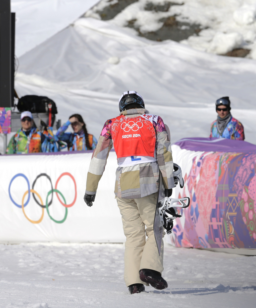 Lindsey Jacobellis of the United States walks off after crashing in the second semifinal of the women’s snowboard cross.