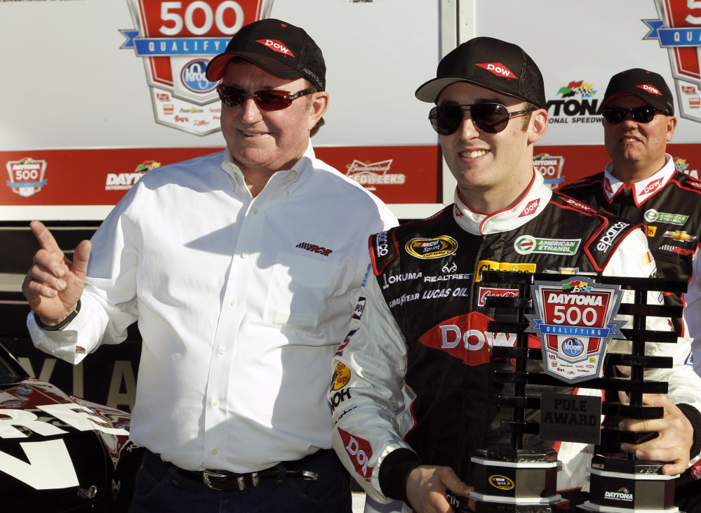 Austin Dillon, right, holds up the pole award with car owner and grandfather Richard Childress after qualifying for the pole position in the Daytona 500 NASCAR Sprint Cup Series auto race at Daytona International Speedway in Daytona Beach, Fla., on Sunday.