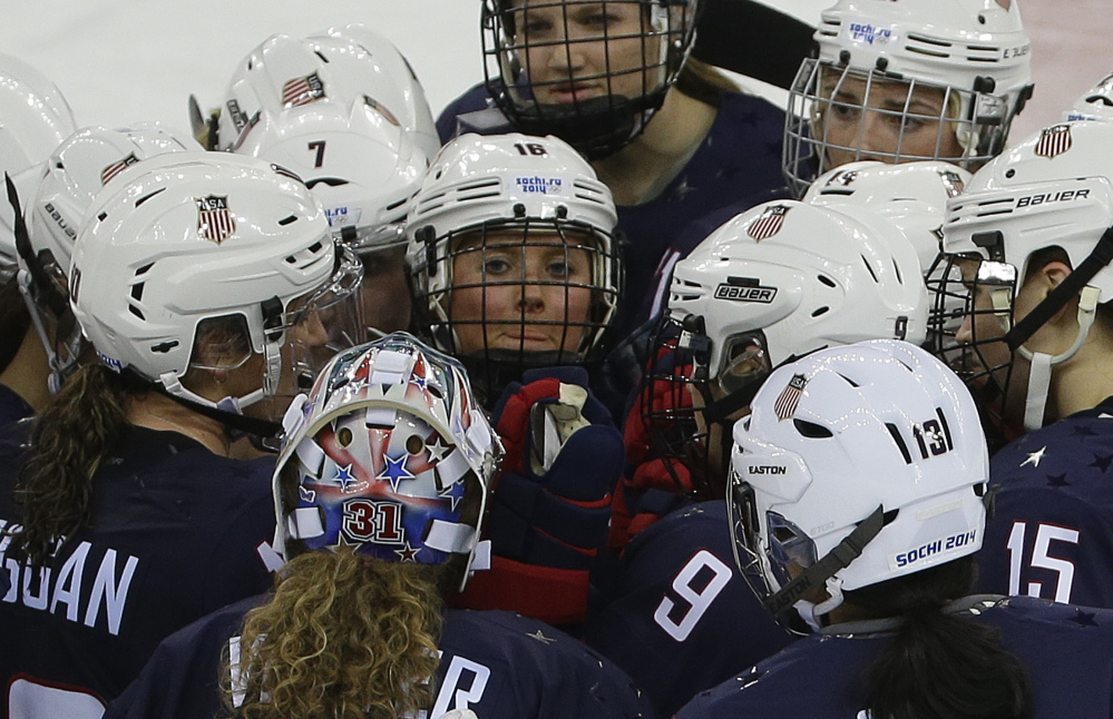 Team USA gathers at mid ice after defeating Sweden 6-1 during a 2014 Winter Olympics women’s semifinal ice hockey game at Shayba Arena on Monday in Sochi, Russia.