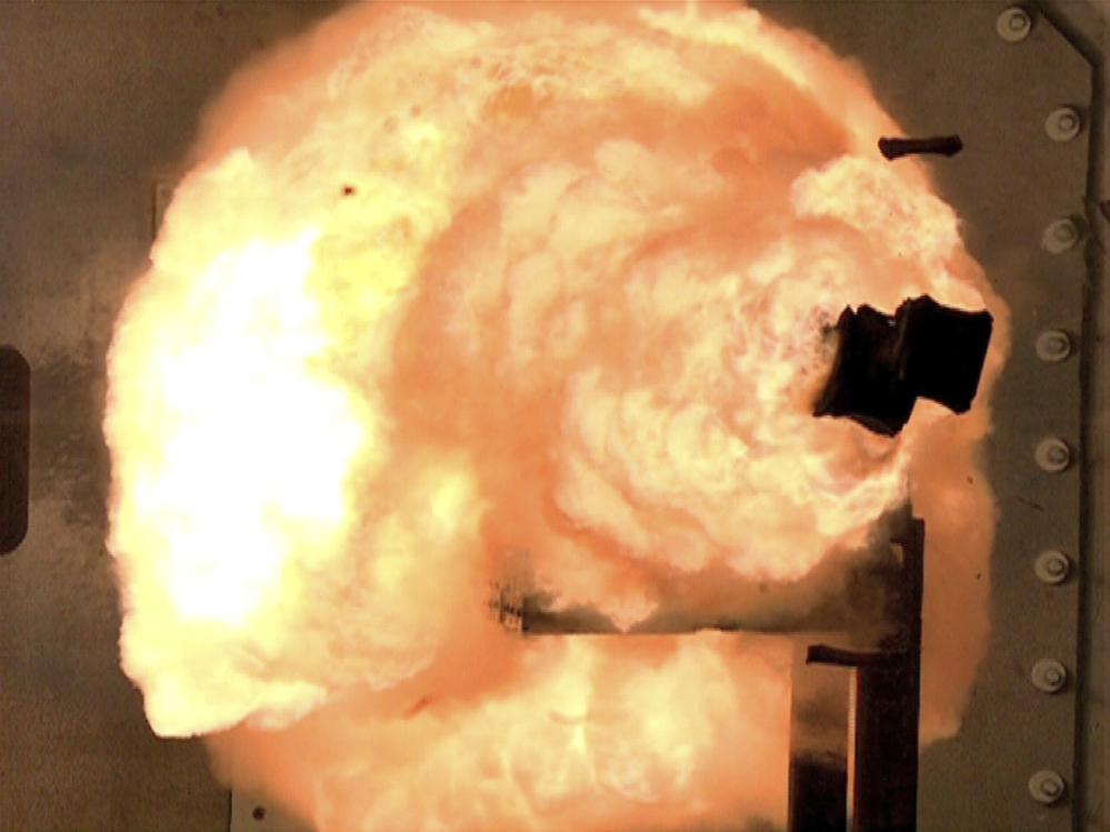 A high-speed camera captures the first full-energy shots from an electromagnetic launcher at a test facility in Dahlgren, Va.