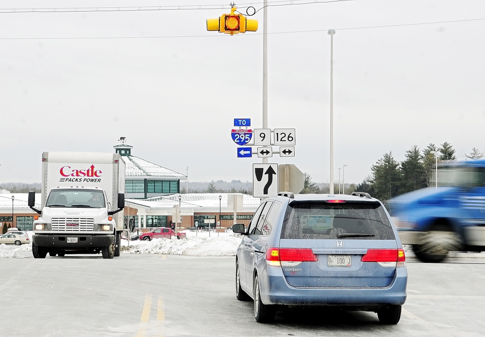 CRASH-PRONE: Drivers entering and leaving the West Gardiner Service Plaza wait for a break in traffic on Route 9 and 126, which doesn’t stop at the intersection, on Tuesday in West Gardiner. The Maine Department of Transportation is proposing a roundabout there.