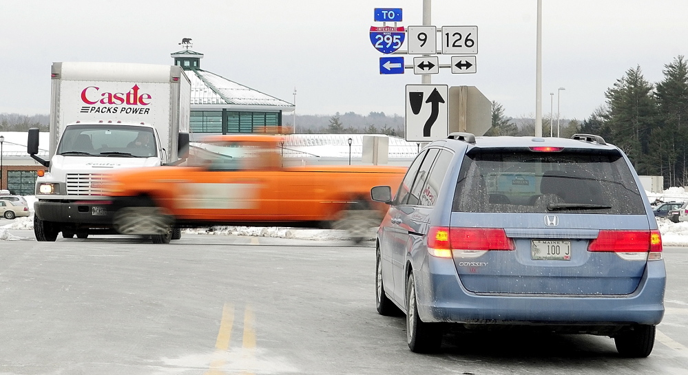 PERILOUS PLACE: Drivers entering and leaving the West Gardiner Service Plaza wait for a break in traffic on Route 9 and 126, which doesn’t stop at the intersection, on Tuesday in West Gardiner. The Maine Department of Transportation is proposing a roundabout there.