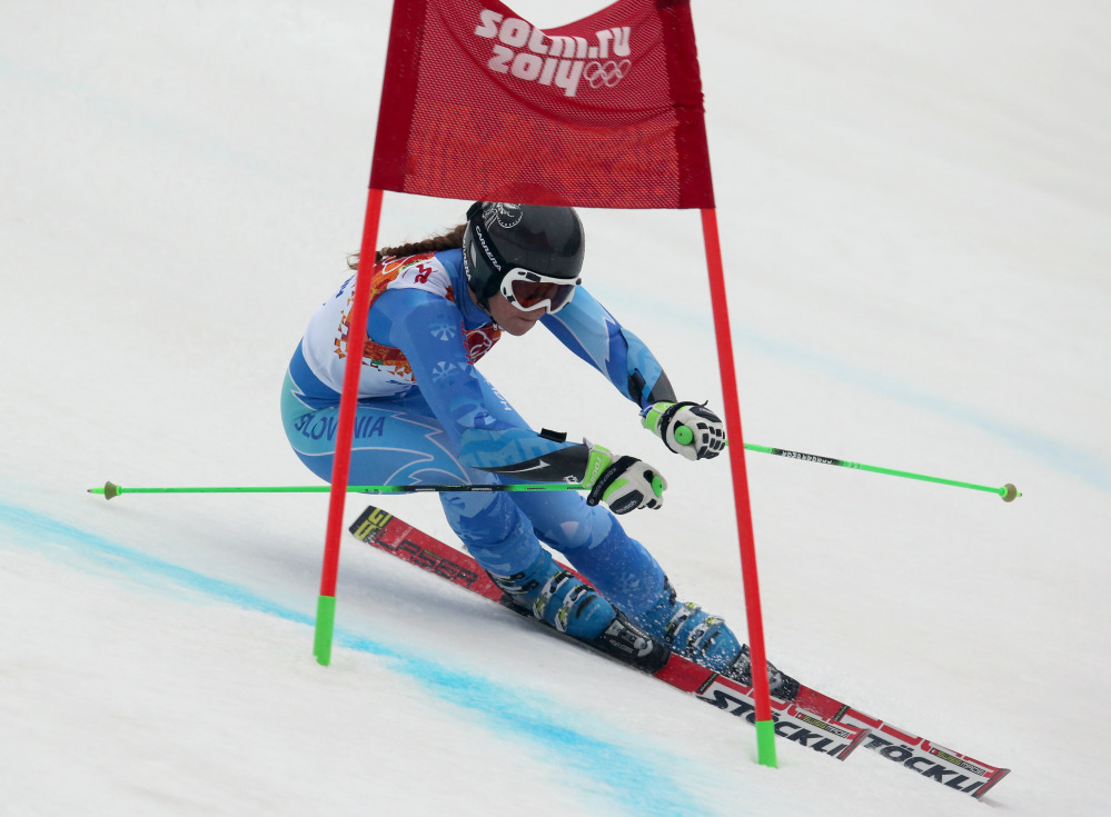 Tina Maze passes a gate in the second run of the women’s giant slalom to win the gold medal at the Sochi 2014 Winter Olympics on Tuesday.