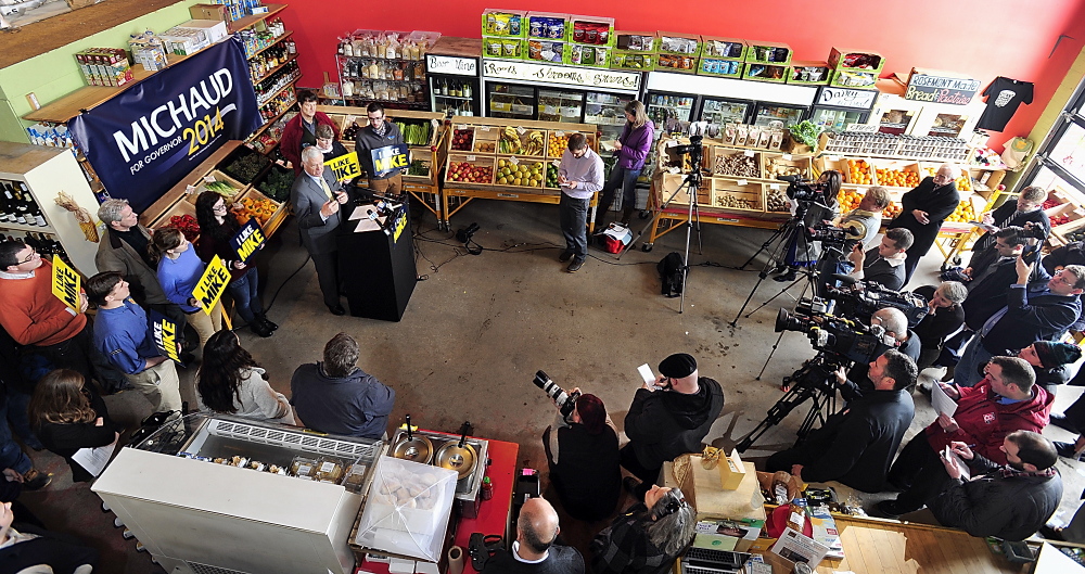 Surrounded by supporters and media, U.S. Rep. Mike Michaud holds a news conference at Rosemont Bakery in Portland to unveil his economic plan if elected governor. “This ... includes concrete ideas and proposals that we can start implementing on day one,” he said.