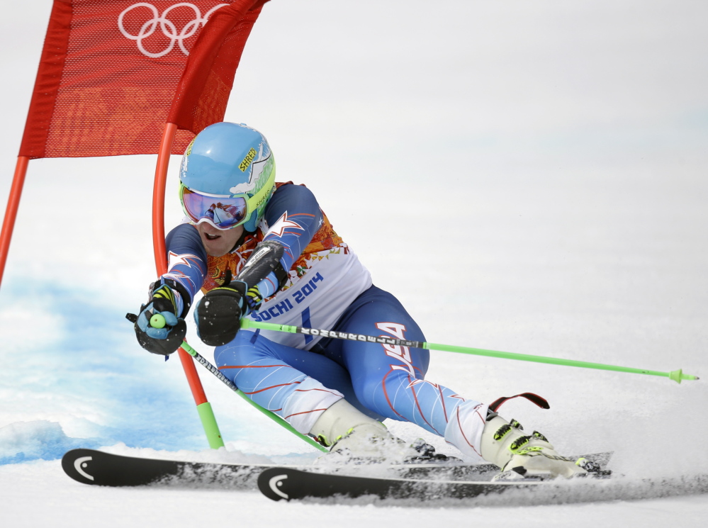 Ted Ligety passes a gate in the first run of the men’s giant slalom at the 2014 Winter Olympics Wednesday.