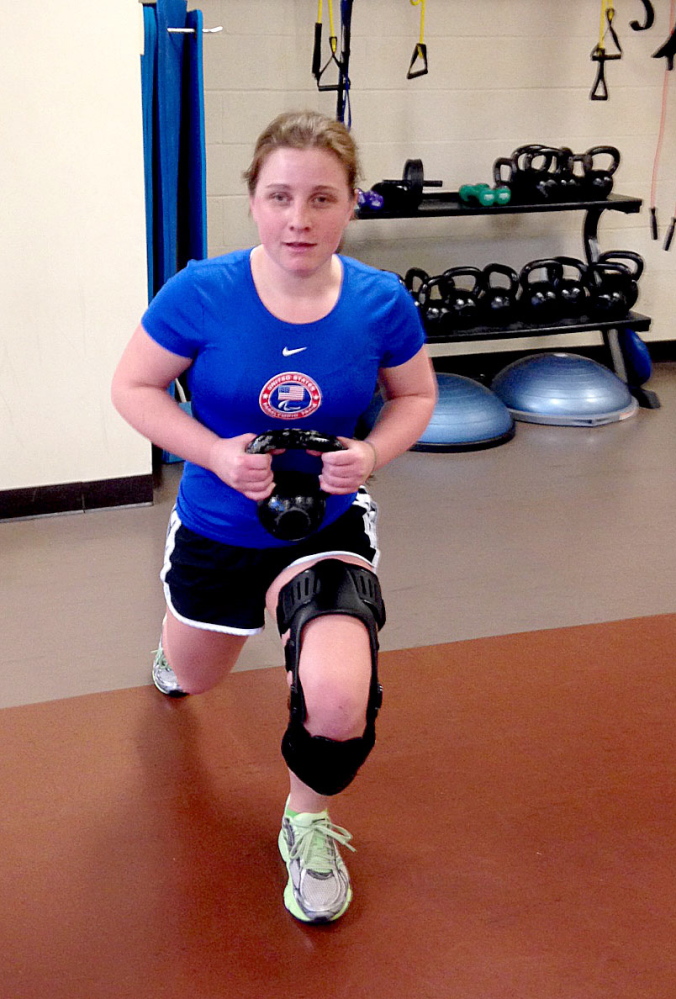 THERAPY: Lindsay Ball of Benton performs physical therapy to prepare for ski racing in Sochi in March. In January, Ball fell down while skiing and tore her ACL, requiring four weeks of intense physical therapy to give her a chance to compete.