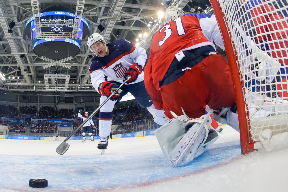 IT’S GOOD: United States forward David Backes celebrates as forward Zach Parise’s shot gets by Czech Republic goaltender Ondrej Pavelec during the second period of men’s quarterfinal game Wednesday in Shayba Arena at the 2014 Winter Olympics in Sochi, Russia.