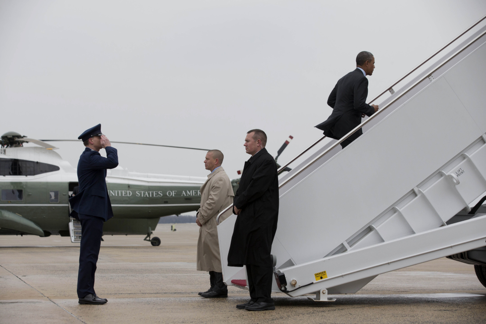 President Barack Obama boards Air Force One at Andrews Air Force Base, Md., on Wednesday prior to traveling to Toluca, Mexico, to meet with Canadian Prime Minister Stephen Harper and Mexican President Enrique Pena Nieto.