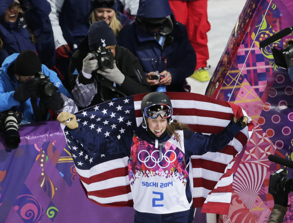 Maddie Bowman of the United States celebrates after winning the gold medal in the women’s ski halfpipe final at the Rosa Khutor Extreme Park, at the 2014 Winter Olympics Thursday in Krasnaya Polyana, Russia.