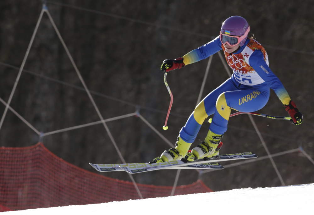 In this Saturday, Feb. 15, 2014 photo, Ukraine’s Bogdana Matsotska makes a jump in the women’s super-G at the Sochi 2014 Winter Olympics in Krasnaya Polyana, Russia. The International Olympic Committee said on Thursday, Feb. 20, that Matsotska has left the Olympics in response to the violence in her country.