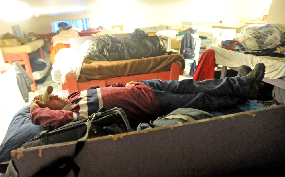 SHELTER: Dan Taylor, 43, of Winthrop, rests on his bunk Thursday at the men’s shelter at Trinity Evangelical Free Church in Skowhegan. Taylor has been staying at the shelter for two weeks.